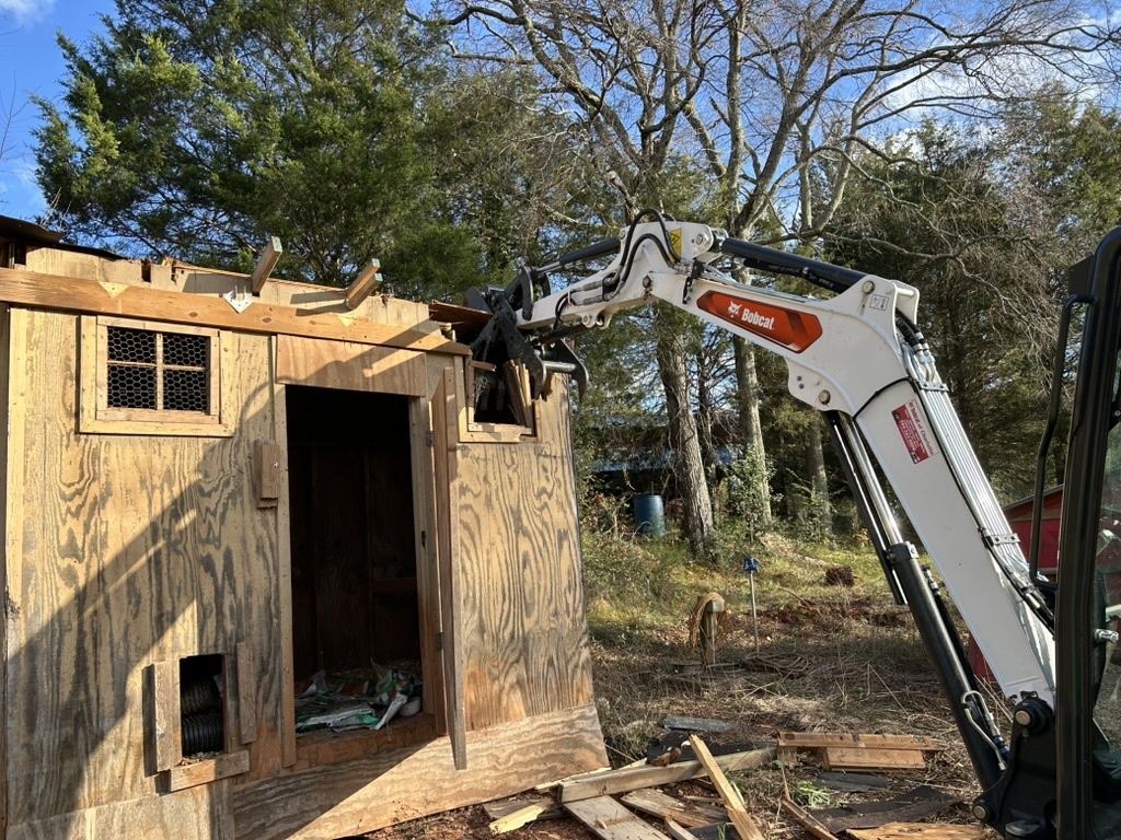 Bobcat telehandler working on wooden building
